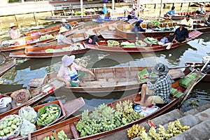AMPHAWA Ã¢â¬â APRIL 29: Wooden boats are loaded with fruits from the orchards at Tha kha floating market